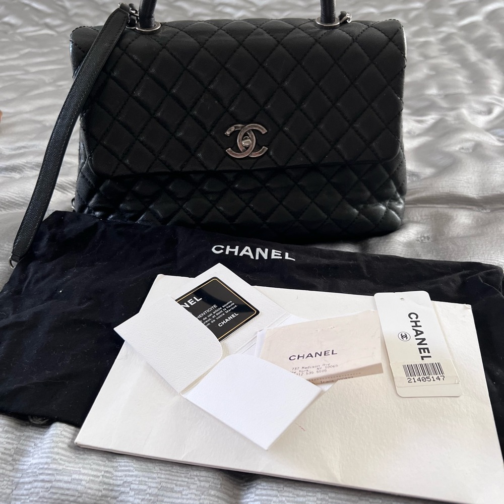 Chanel coco caviar top handle medium bag.